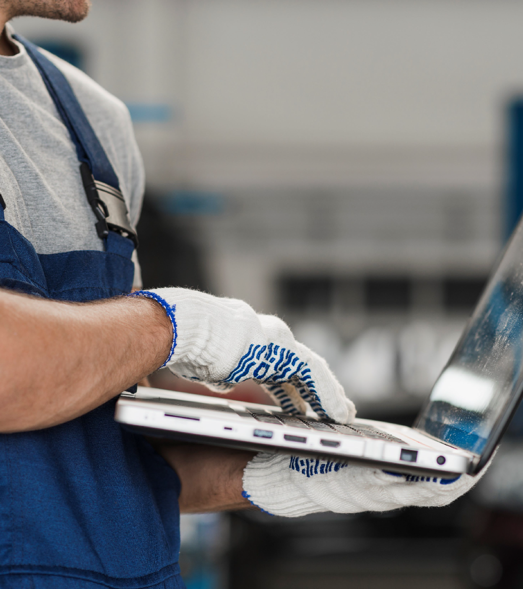 Field worker using the TerraTrackr platform on a laptop on-site